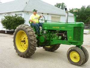 Vintage John Deere Tractor in Antique Tractor Parade at County Fair